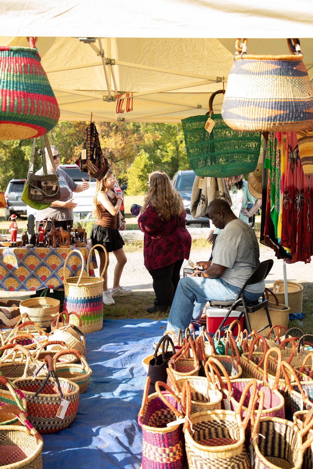 African basket booth framed by hanging handwoven baskets