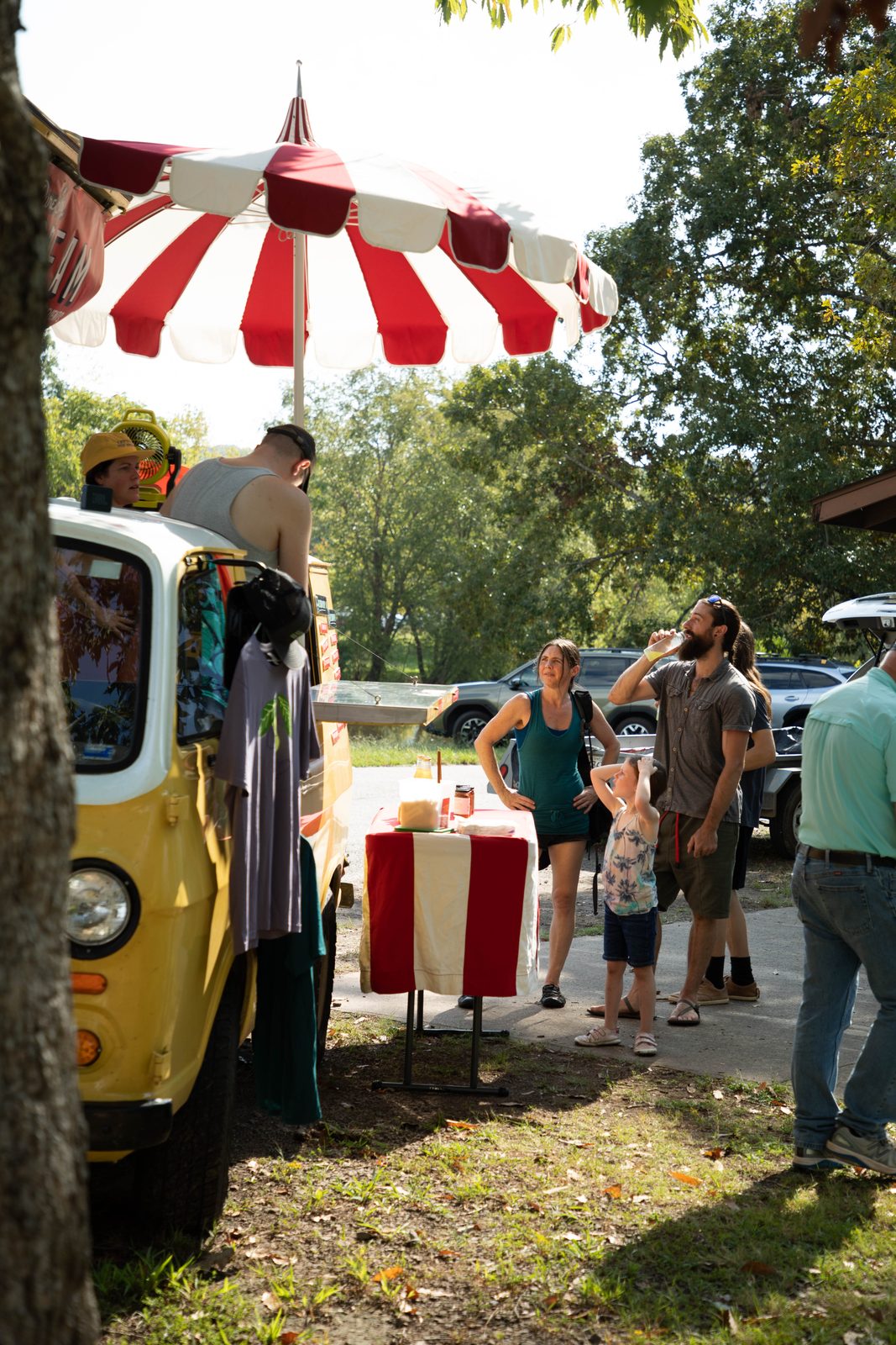 Family with lemonade in front of the Pure Joy Ice Cream van
